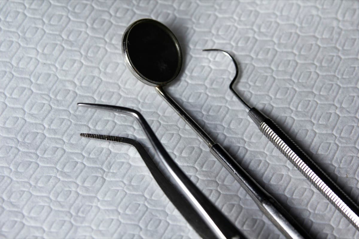 Dental mirror and probes laid out on a tray